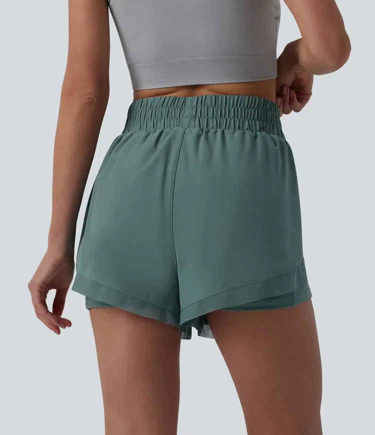 Med hög midja kontrastmesh 2-i-1 löpning shorts med fickor