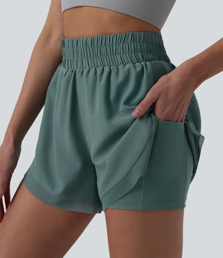 Med hög midja kontrastmesh 2-i-1 löpning shorts med fickor