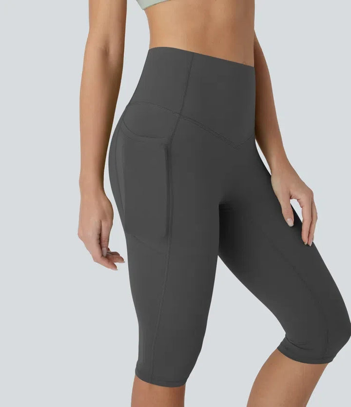 Halara UltraSculpt med hög midja och magkontroll piratbyxor yogaleggings med fickor
