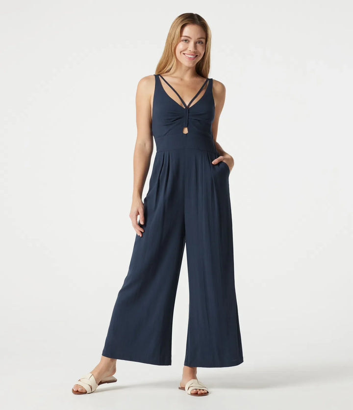 V-ringad ärmlös smockad vardaglig baggy jumpsuit med fickor