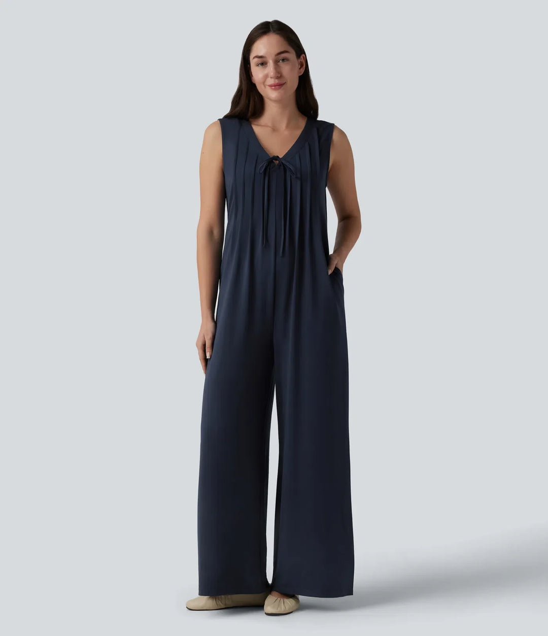 Djup V-ringning knytning fram veckad ärmlös dold dragkedja vardaglig baggy jumpsuit med fickor