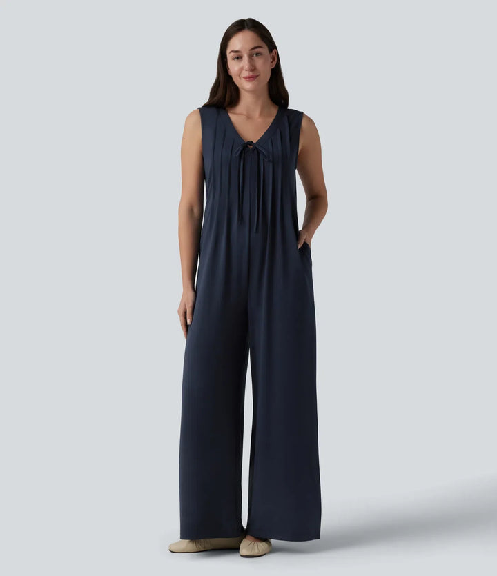 Djup V-ringning knytning fram veckad ärmlös dold dragkedja vardaglig baggy jumpsuit med fickor