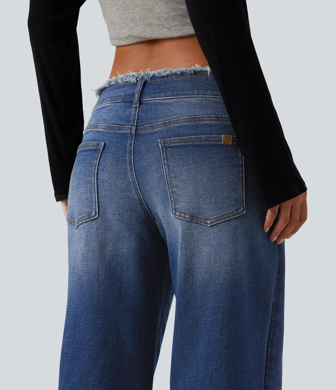 Med låg midja rå fåll vida ben vardagsjeans med fickor
