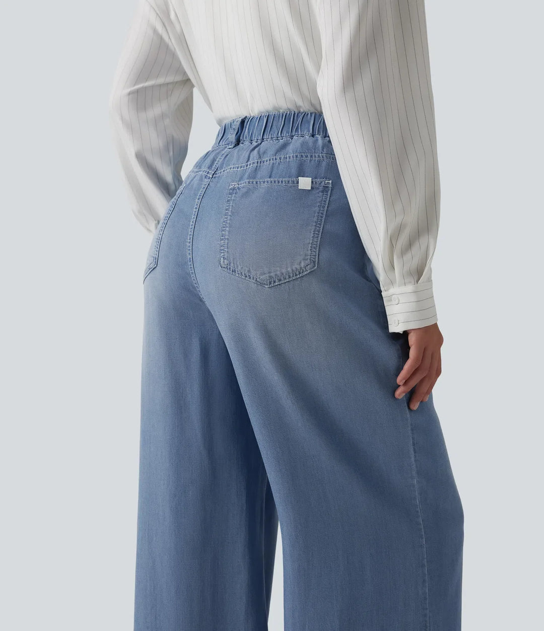 Högmidjad vida ben vardagsjeans med fickor