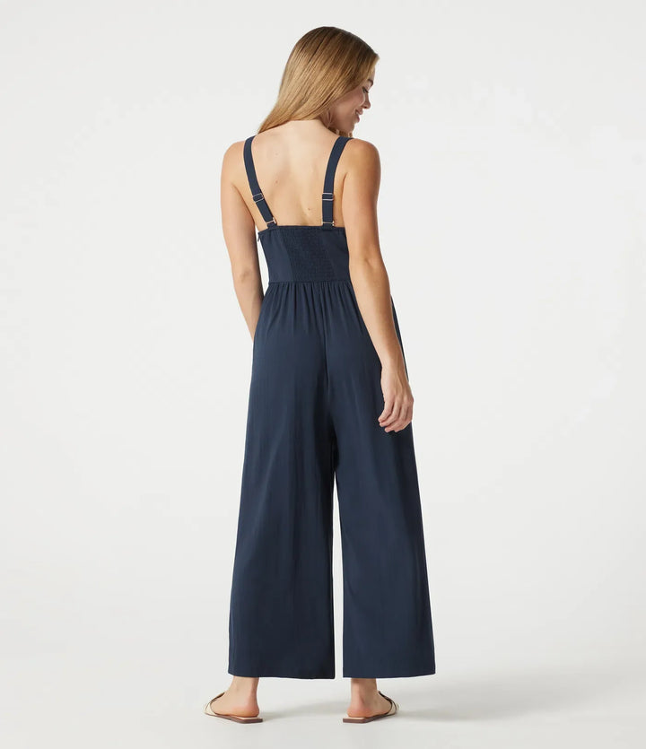 V-ringad ärmlös smockad vardaglig baggy jumpsuit med fickor