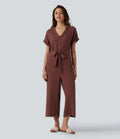 V-ringad kortärmad bältad croppad vardaglig baggy jumpsuit med fickor