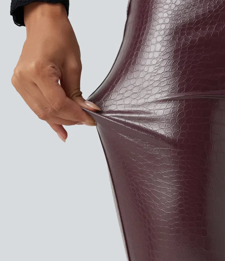 Med hög midja ormskinnsmönster tryck stretchig PU fleece vardagsleggings med fickor