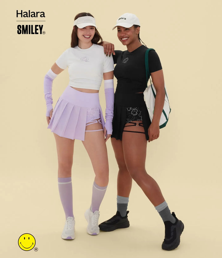Halara X Smiley® Breezeful med hög midja plisserad 2-i-1 asymmetrisk fåll snabbtorkande mini danskjol med fickor