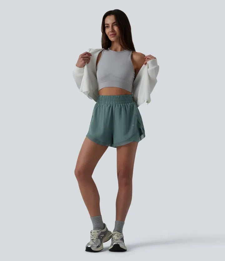 Med hög midja kontrastmesh 2-i-1 löpning shorts med fickor