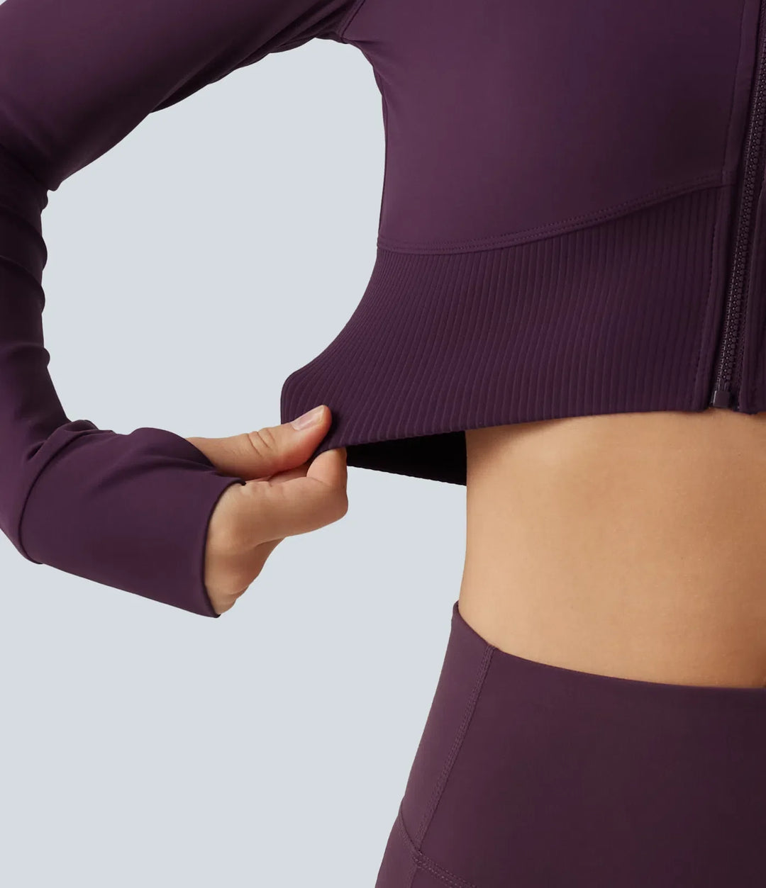 Lyckera UltraSculpt halvpolo lång raglanärm tumhål croppad yogajacka