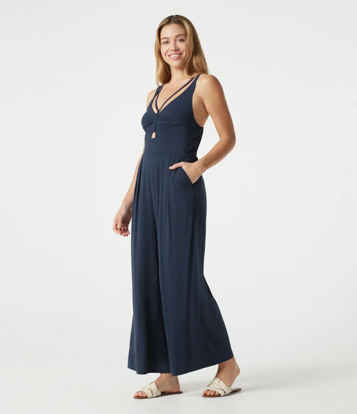 V-ringad ärmlös smockad vardaglig baggy jumpsuit med fickor
