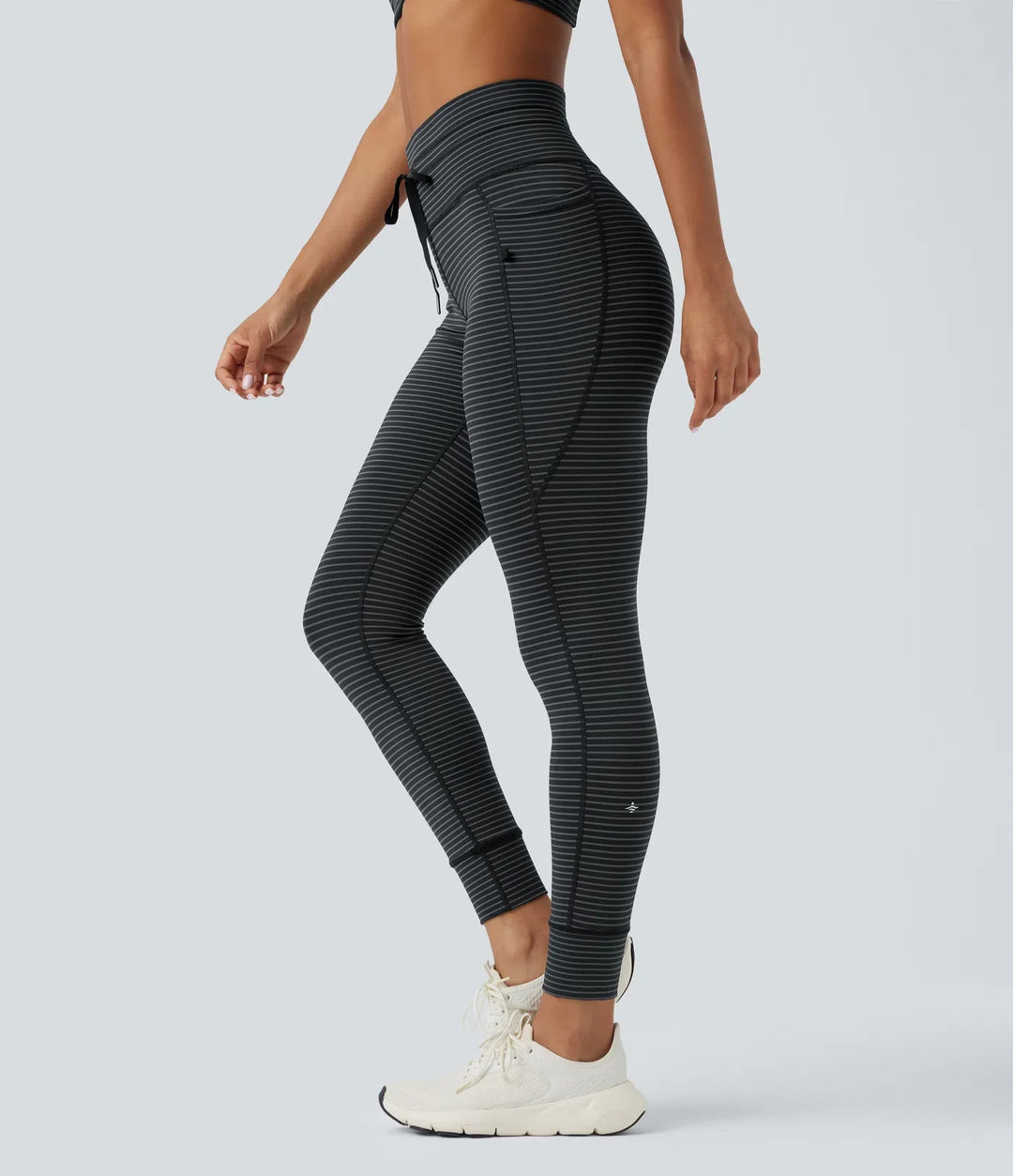 Högmidjad dragsko randig yogaleggings med fickor