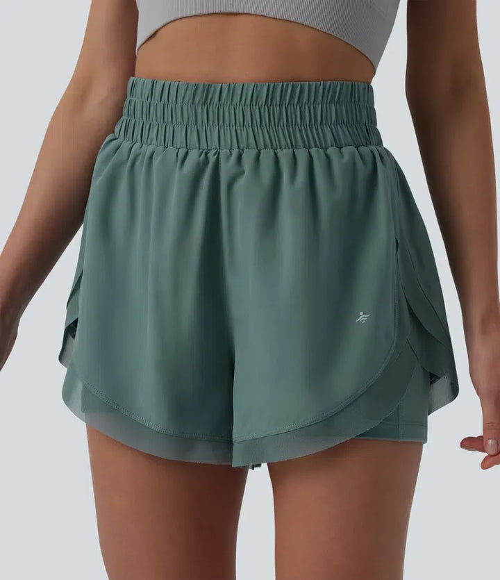 Med hög midja kontrastmesh 2-i-1 löpning shorts med fickor