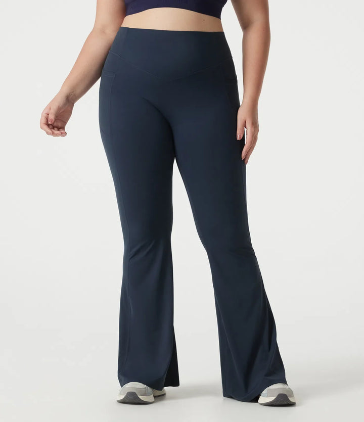 Lyckera UltraSculpt plusstorlek högmidjad scrunch med rumplyft magkontroll formande yoga utsvängd leggings med fickor