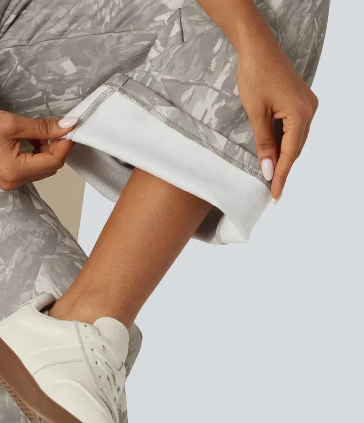 Medelhög midja raka ben mönstrad inner dragsko fleece vardaglig mjukisbyxor med fickor