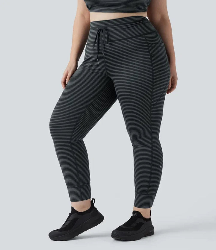 Med hög midja dragsko randig yoga leggings i plusstorlek med fickor