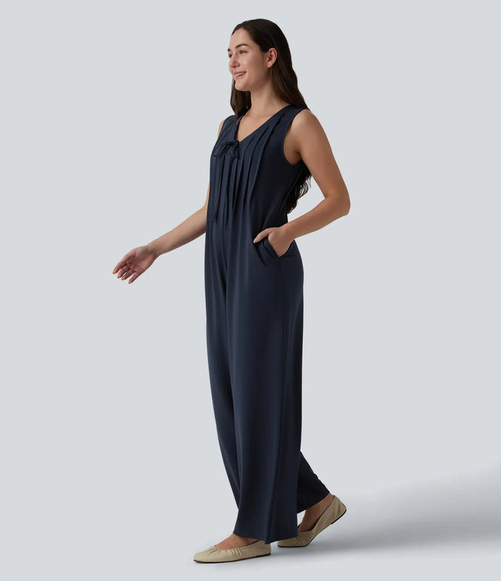 Djup V-ringning knytning fram veckad ärmlös dold dragkedja vardaglig baggy jumpsuit med fickor