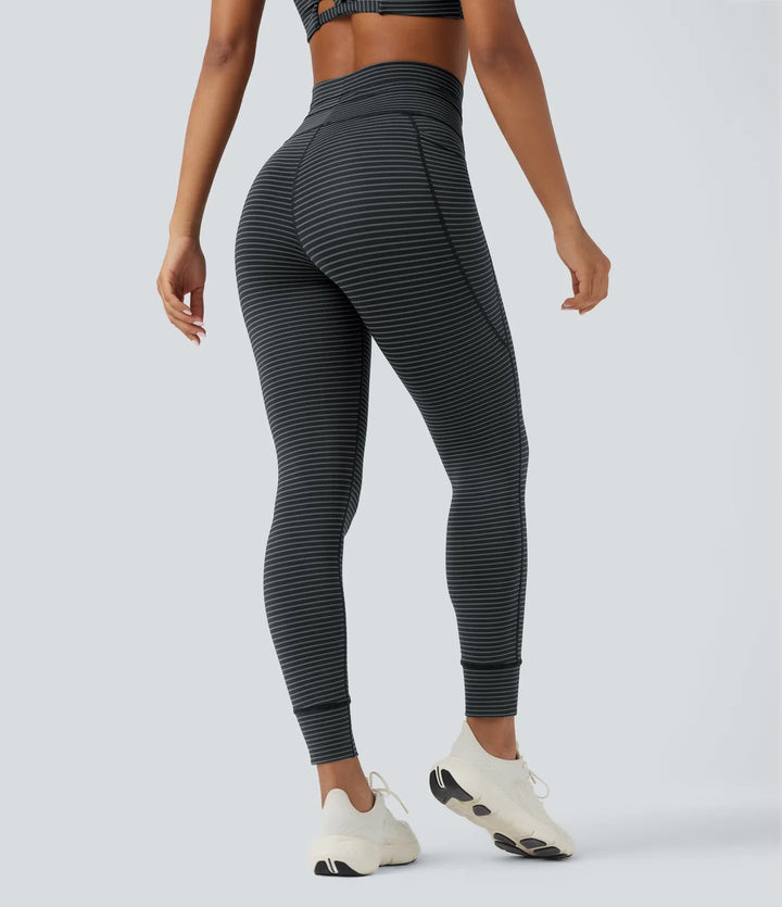 Högmidjad dragsko randig yogaleggings med fickor
