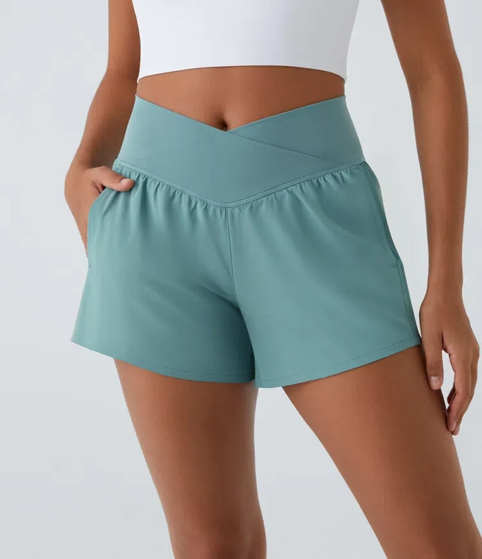 Breezeful med hög midja, omlottmidja och ficka 2-i-1 snabbtorkande yogashorts 4"