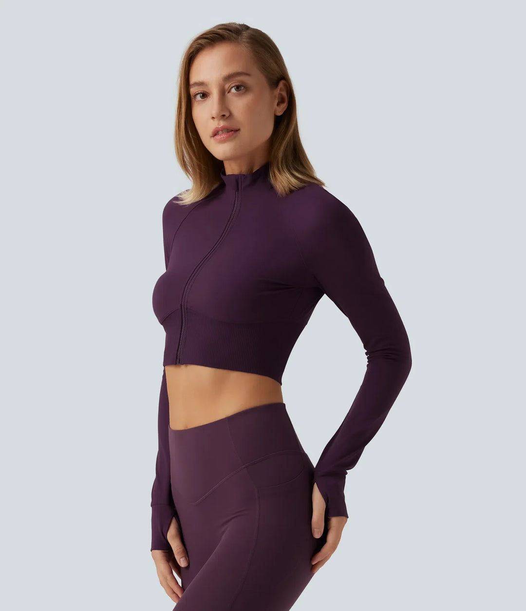 Lyckera UltraSculpt halvpolo lång raglanärm tumhål croppad yogajacka