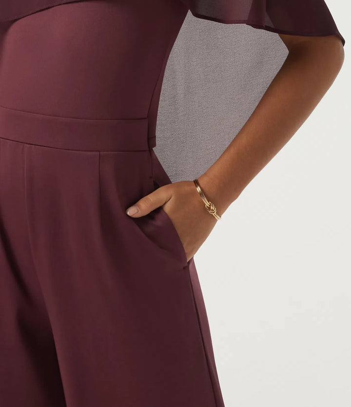 Rund hals ärmlös smal vida ben asymmetrisk jumpsuits för fest med fickor -Easy Peezy Edition