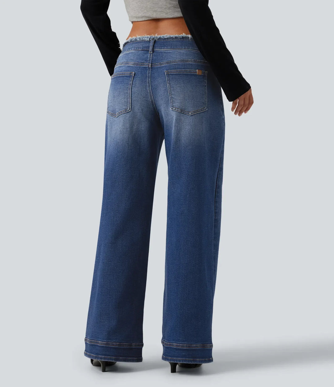 Med låg midja rå fåll vida ben vardagsjeans med fickor