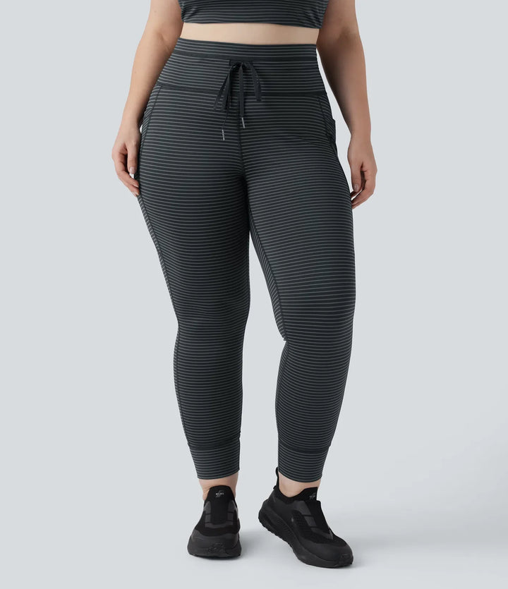 Med hög midja dragsko randig yoga leggings i plusstorlek med fickor