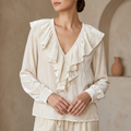 VELOURA V-RINGAD BLUS MED VOLANG