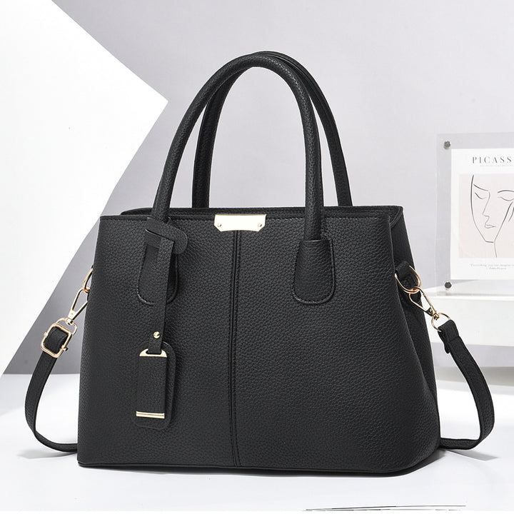 Svart strukturerad handväska i konstläder